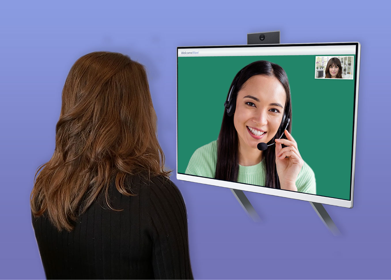 woman facing the virtual front-desk receptionist kiosk machine