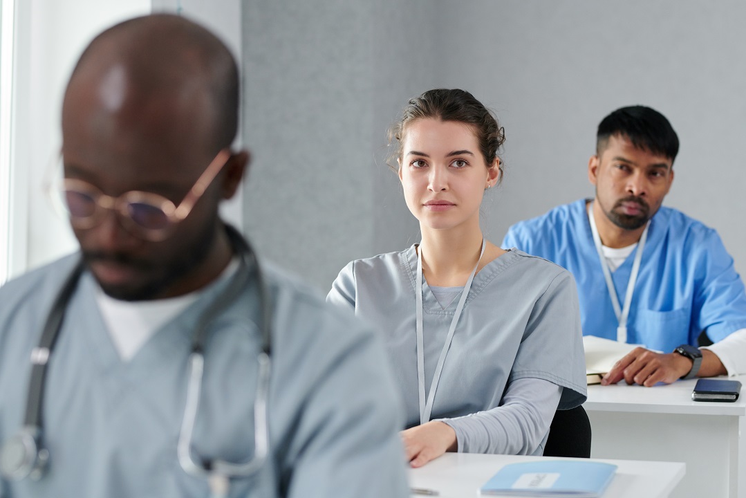 Healthcare receptionists receiving training to improve front desk performance